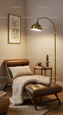 Cozy Reading Nook with Leather Chaise and Warm Lighting
