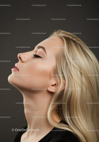 Blonde woman with closed eyes and serene expression