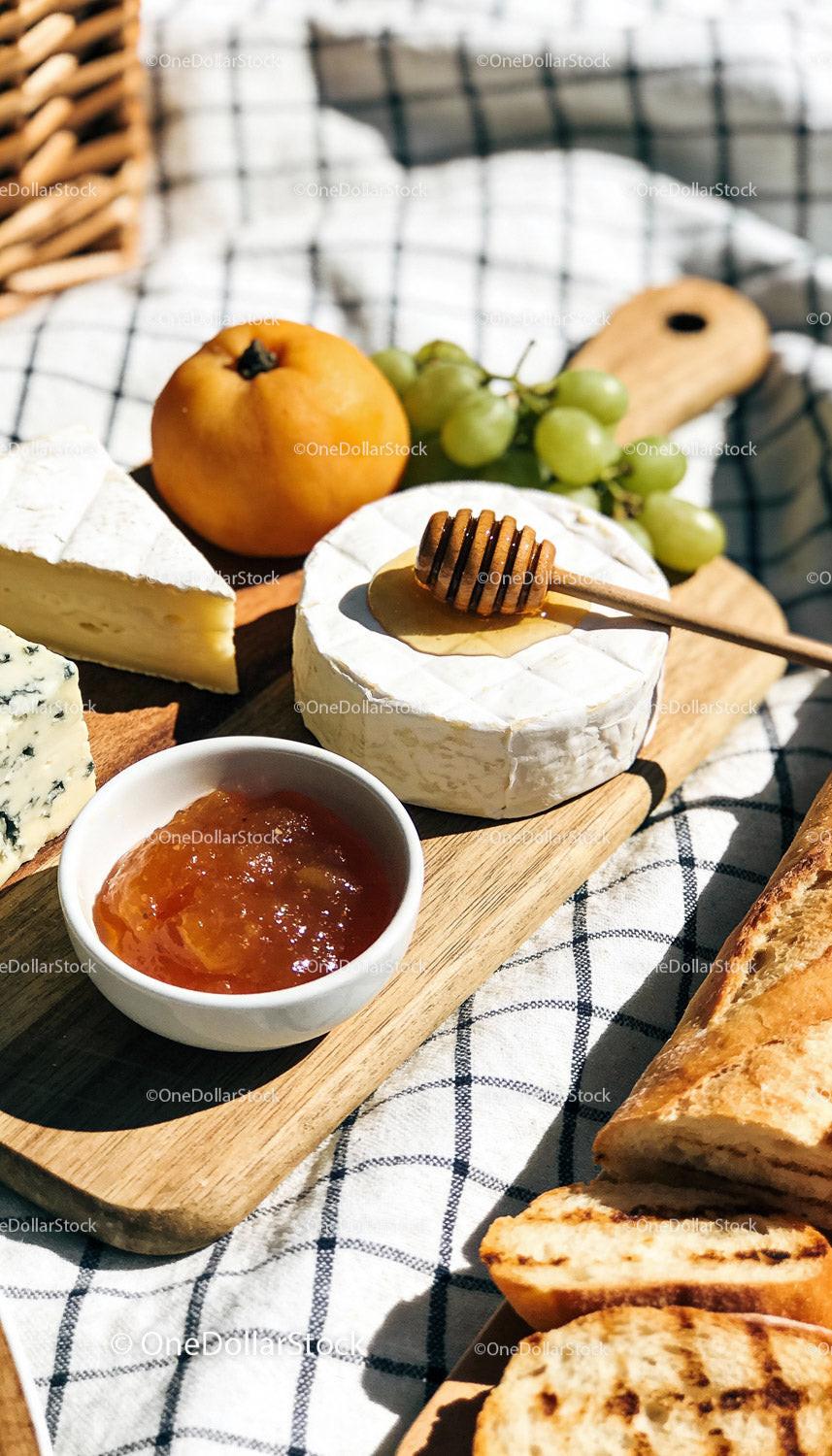 Cheese Platter with Honey, Fruit, and Grilled Bread