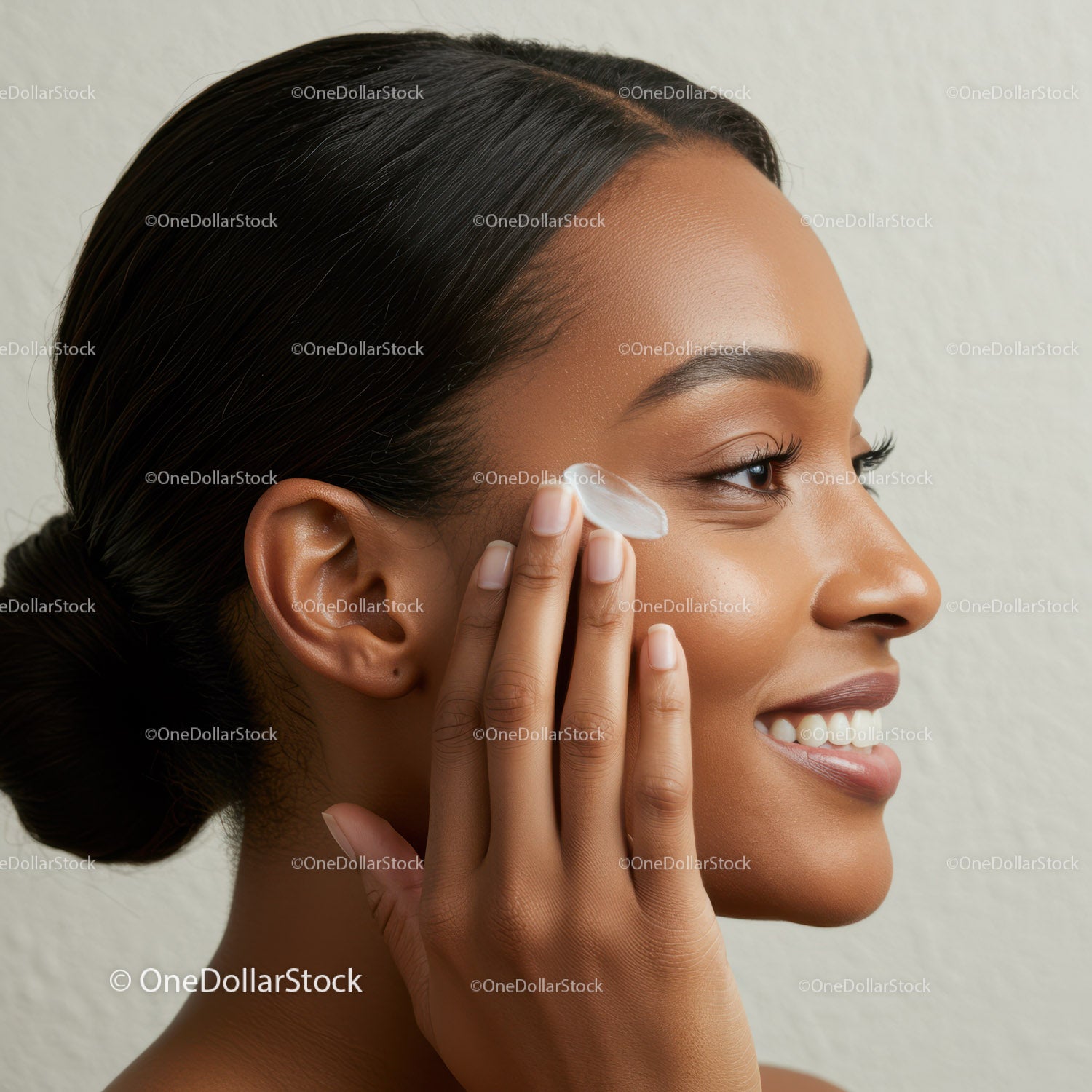 Portrait of a Woman Applying Face Moisturizer for Healthy Skin
