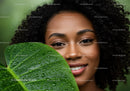 Smiling Woman with Large Tropical Leaf and Water Droplets