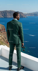 Man in Green Suit Enjoying Stunning Sea View on Balcony