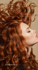 Profile of serene woman with flowing red curly hair