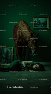 Woman Lying on Floor Beside a Horse in Dramatic Green Room