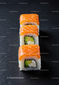 Fresh salmon sushi rolls with avocado and cream cheese