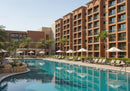 Luxurious Resort with Swimming Pool and Tropical Palm Trees Outdoor