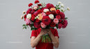 Person Holding Large Bouquet of Vibrant Flowers