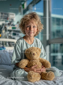 Child with Teddy Bear in Hospital Room During Medical Treatment