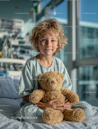 Child with Teddy Bear in Hospital Room During Medical Treatment