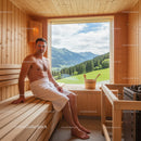 Male in Wooden Sauna with Mountain View and Natural Light