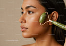 Woman Using Jade Roller for Facial Skincare and Rejuvenation