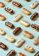 Assorted Mini Eclairs With Different Cream Toppings