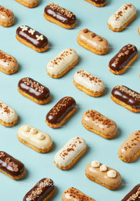 Assorted Mini Eclairs With Different Cream Toppings