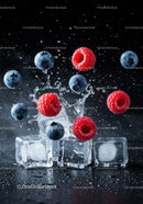 Fresh raspberries and blueberries splash over ice cubes
