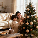 Mother and son decorating Christmas tree at home