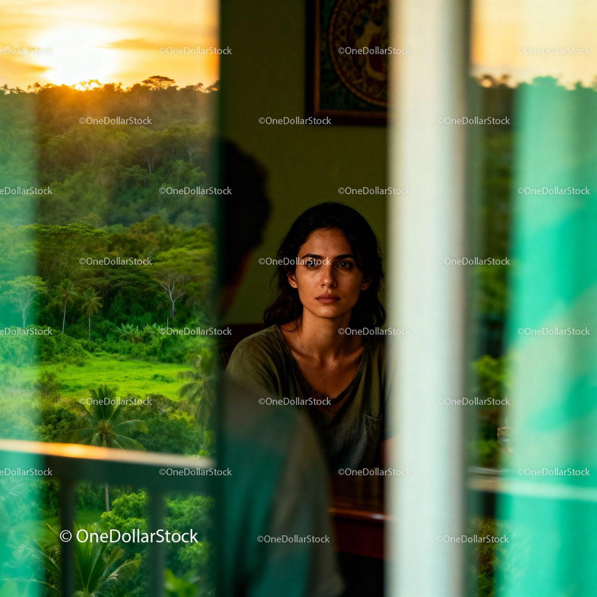 Contemplative woman reflecting indoors at sunset