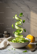 Fresh cucumber ribbons with mint and lemon zest in bowl