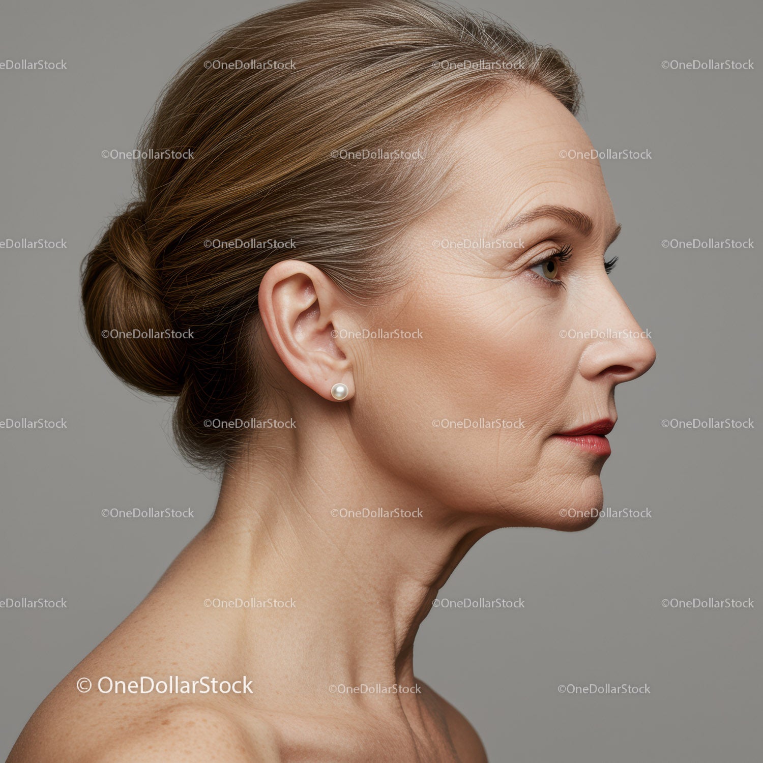 Elegant Mature Woman Side Profile with Pearls and Smooth Skin