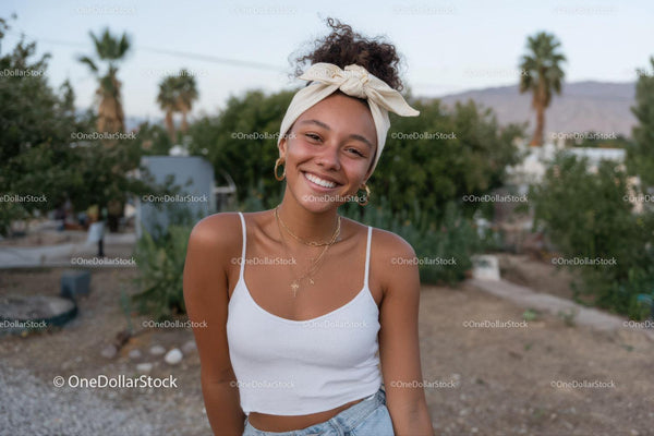 Smiling Young Woman in Summer Outfit in Desert Park