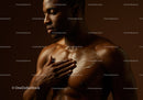 Elegant African Woman Applying Skin Lotion in Beauty Portrait