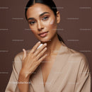 Elegant Woman Applying Facial Moisturizer with Flawless Skin