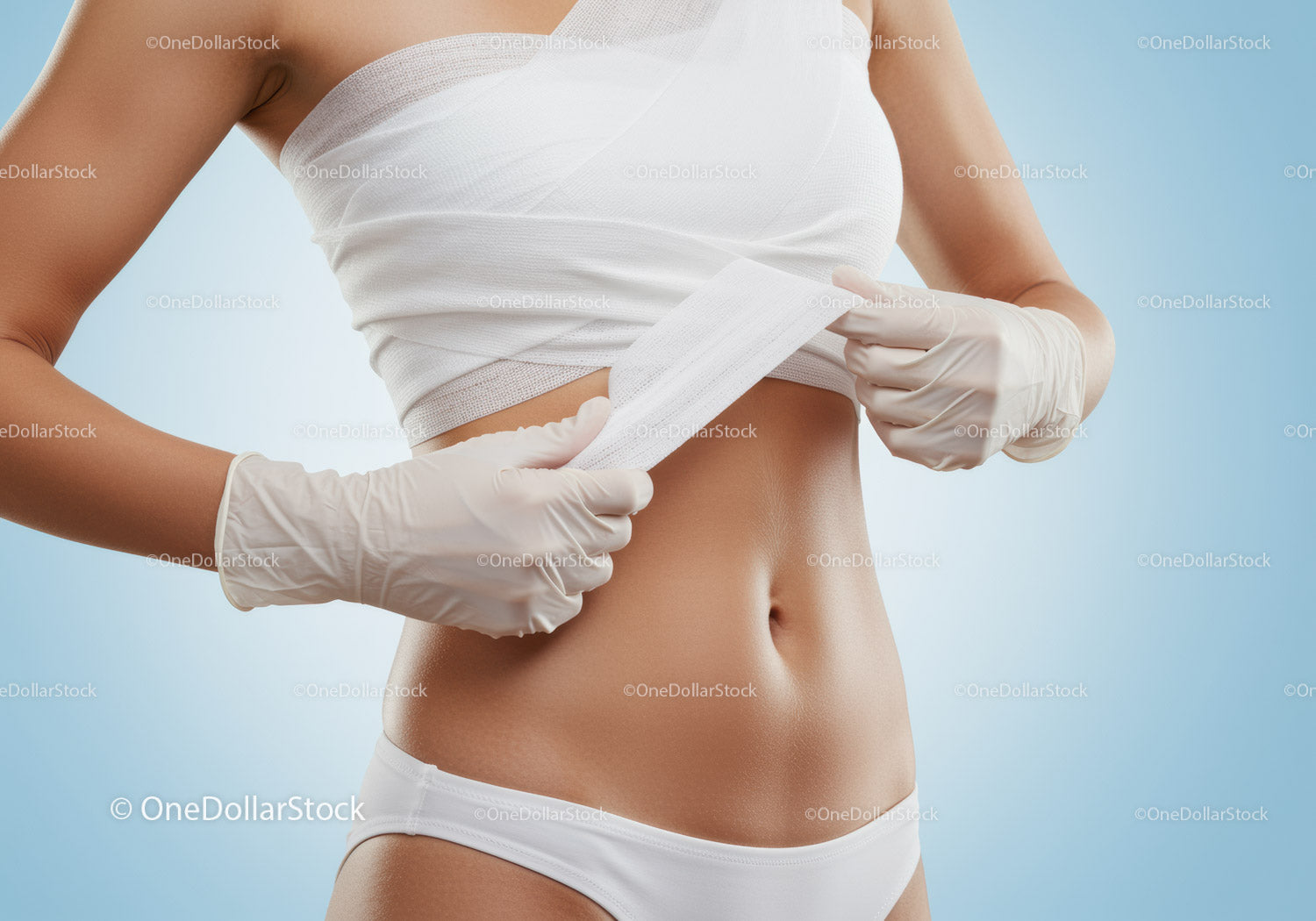 Woman Removing Adhesive Bandage from Abdomen for Wound Care