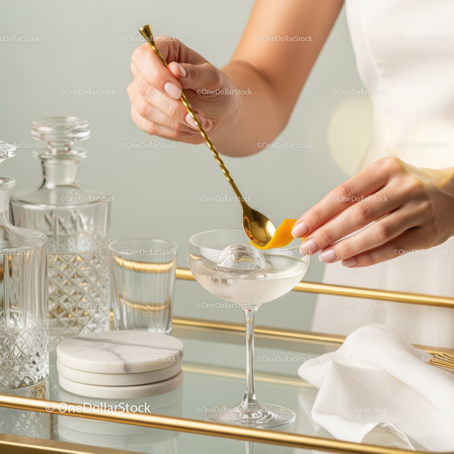 Elegant Cocktail with Lemon Peel and Gold Spoon in Stylish Bar