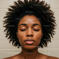 African American Woman with Curly Hair and Moisturizing Facial Mask