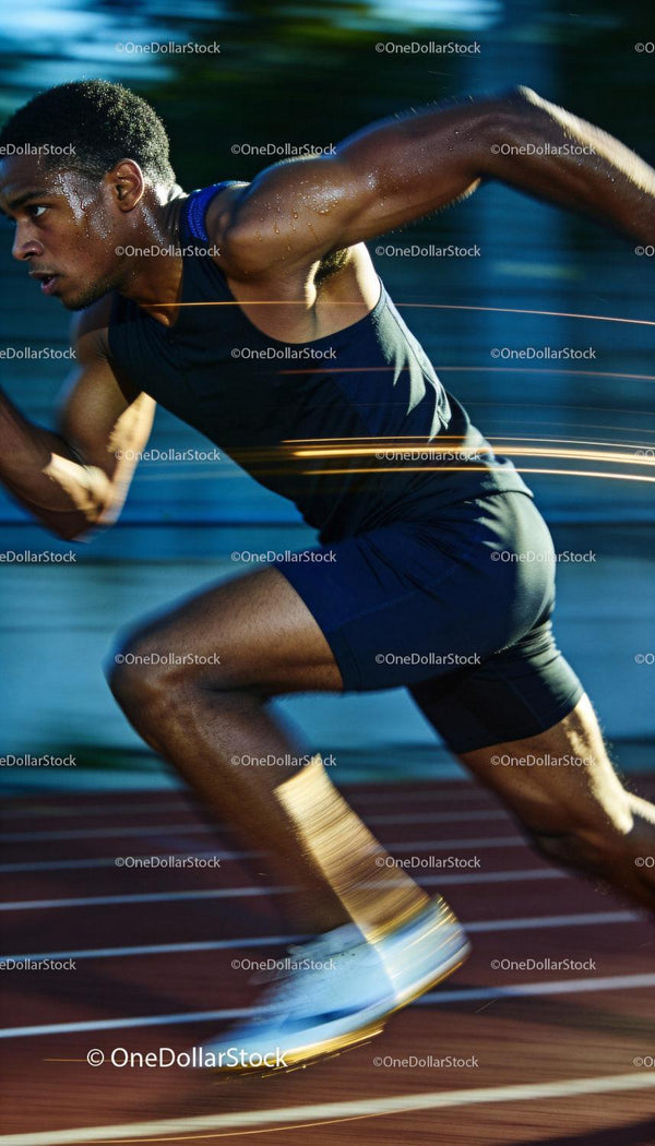 Athlete sprinting with focused intensity on track