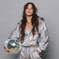 Stylish Woman in Metallic Outfit Holding Disco Ball for Modern Fashion