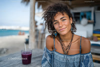 Young Woman Smiling at Beachside Cafe in Summer Fashion