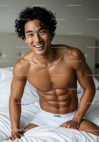 Smiling muscular man in white underwear on bed