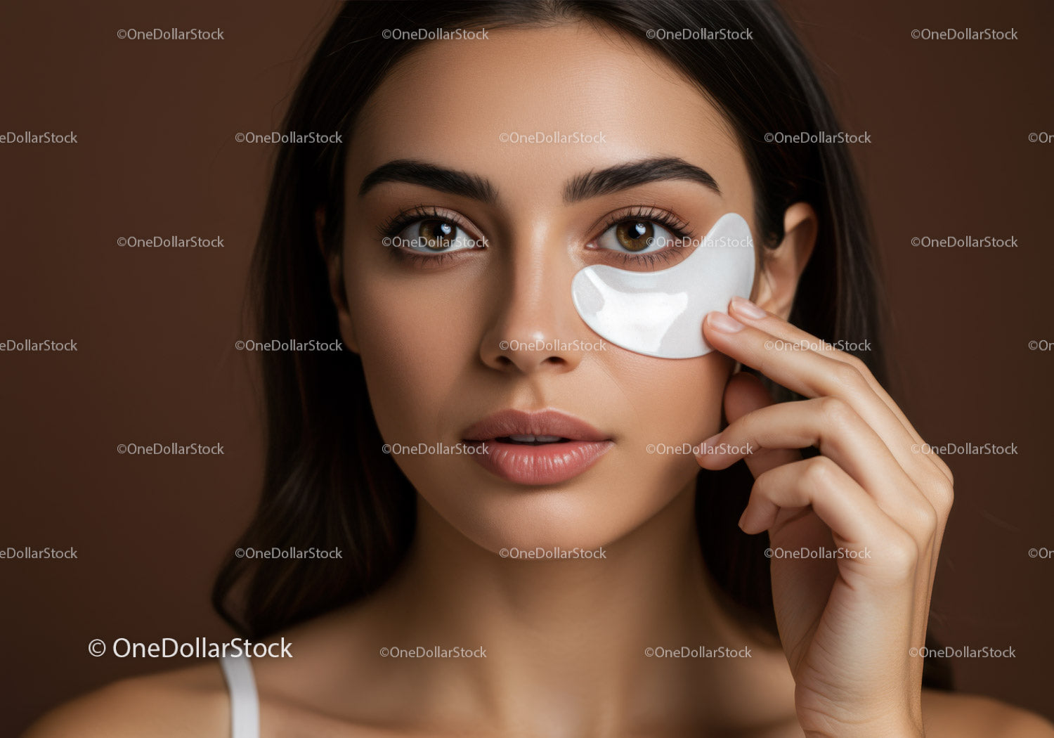 Close-up of Young Woman Applying Facial Mask for Skincare