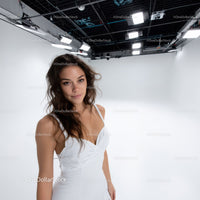 Young Woman Smiling Confidently in Modern Studio Portrait