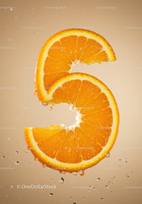 Fresh orange slices forming number five with water drops