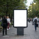 Blank urban billboard on busy pedestrian walkway