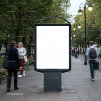 Blank urban billboard on busy pedestrian walkway