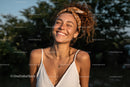 Joyful Woman Smiling Outdoors in Summer Fashion