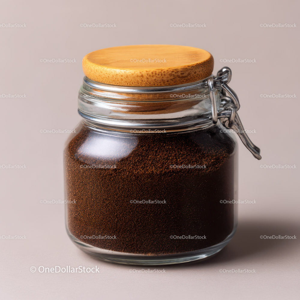 Glass Jar Filled with Fine Ground Coffee and Coffee Beans