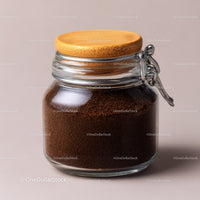 Glass Jar Filled with Fine Ground Coffee and Coffee Beans