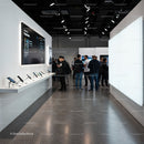 Group of people exploring latest smartphones at tech event