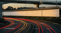 City Highway with Light Trails During Sunset in Urban Environment