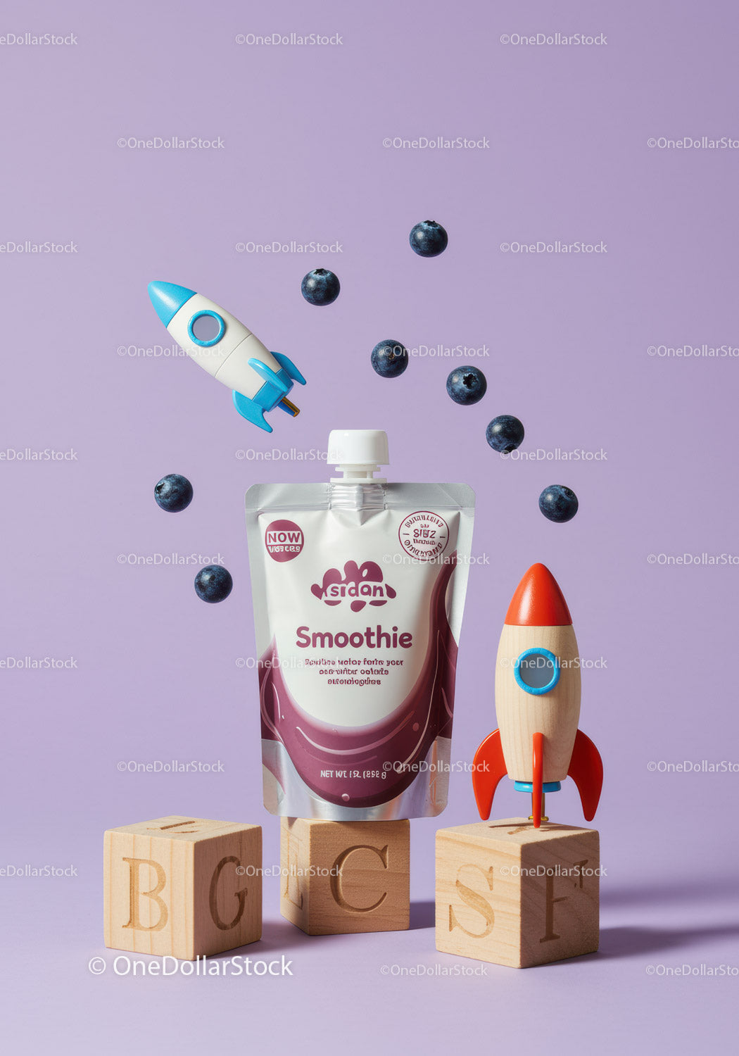 Blueberry smoothie with toy rockets on wooden blocks