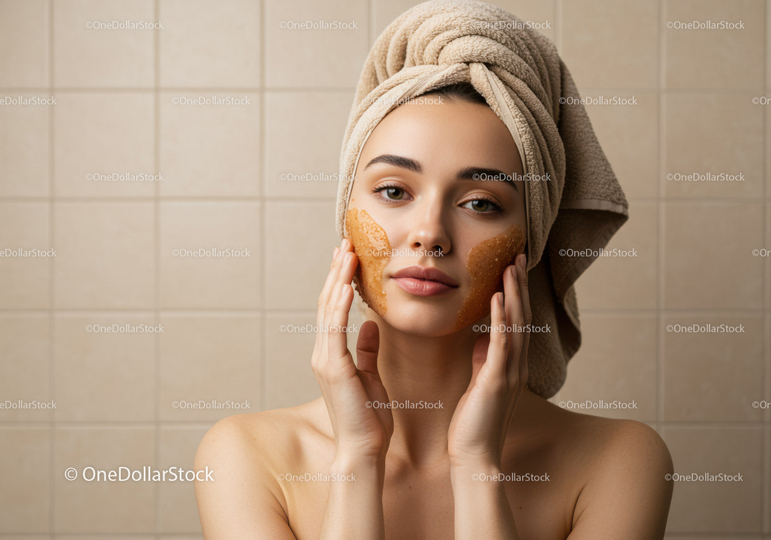 Young Woman Applying Facial Mask with Towel Wrapped Head