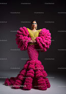 Fashion Model in Vibrant Pink and Yellow Flowing Gown