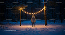 Child Standing Beneath Warm String Lights in Snowy Forest