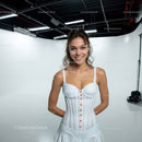 Young Woman Smiling in White Corset in Studio Photography