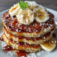 Banana Pancakes with Caramel Syrup Coconut Flakes and Mint