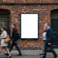 Busy pedestrians passing blank billboard on brick wall