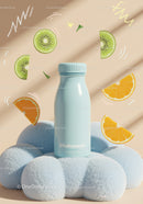 Blue bottle on soft cloud with fresh fruit slices